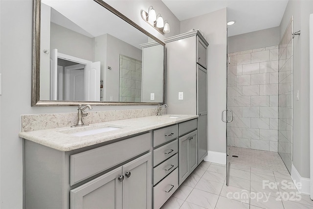 bathroom featuring vanity and a shower with shower door