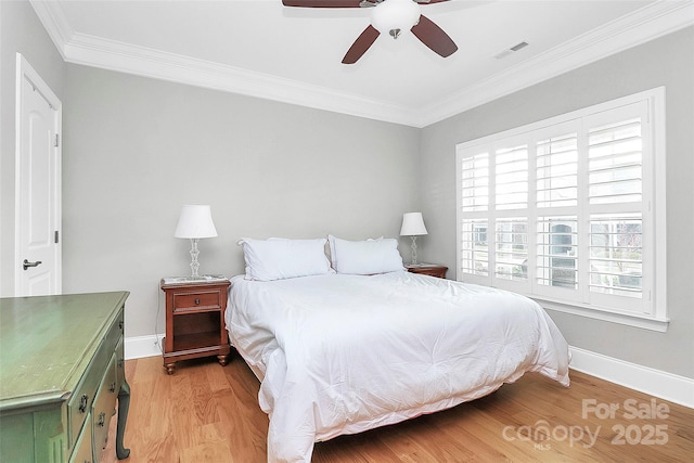 bedroom with ornamental molding, light wood-type flooring, and ceiling fan