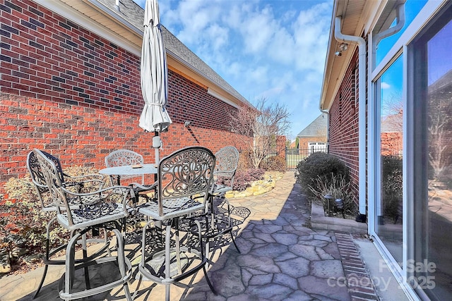 view of patio / terrace featuring outdoor dining space and fence