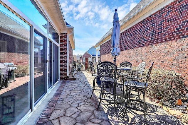 view of patio / terrace with grilling area and outdoor dining space