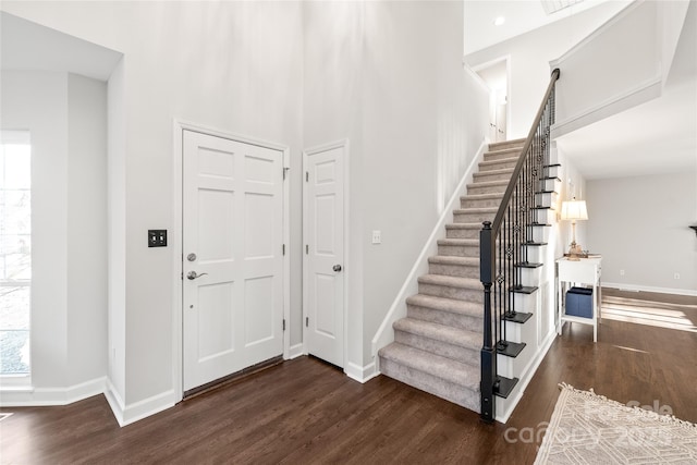 entrance foyer featuring dark hardwood / wood-style flooring and plenty of natural light