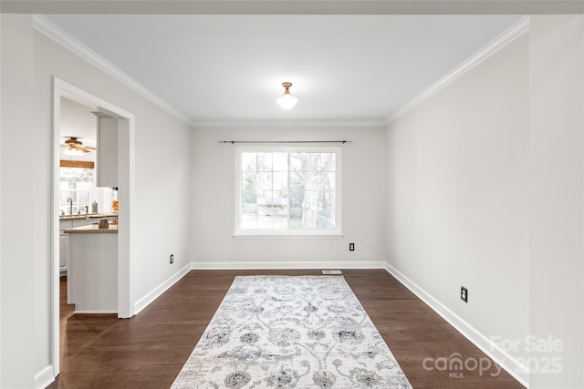 unfurnished room featuring dark hardwood / wood-style floors and ornamental molding