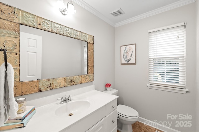 bathroom featuring tile patterned floors, toilet, vanity, and ornamental molding