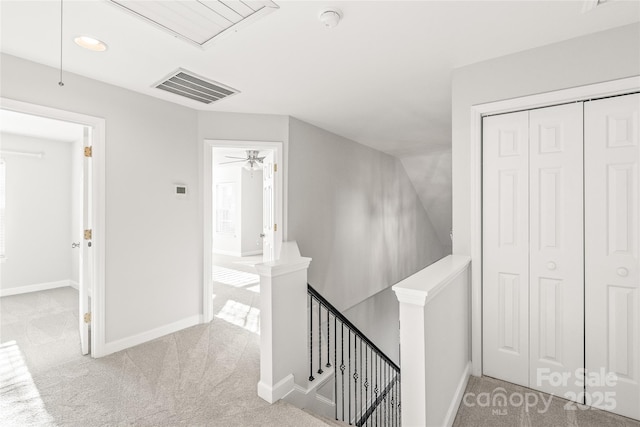 corridor with light colored carpet