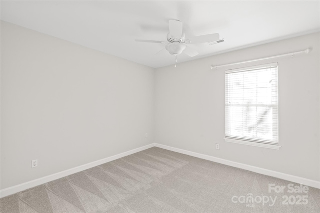 empty room featuring carpet and ceiling fan