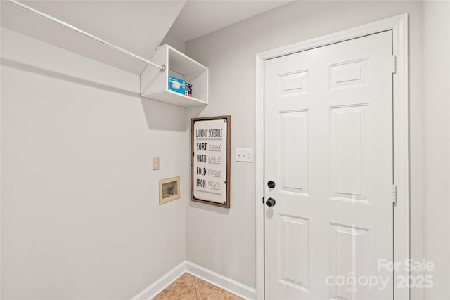 washroom featuring tile patterned floors and washer hookup