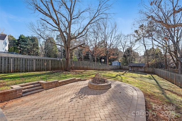 view of patio featuring a shed