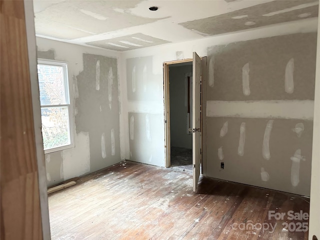 empty room featuring hardwood / wood-style flooring