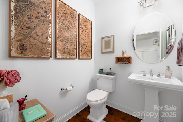 bathroom featuring toilet and sink