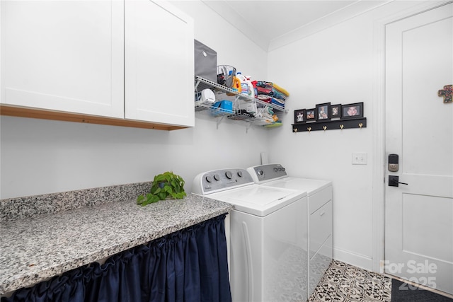 laundry room with washer and dryer, light tile patterned flooring, cabinets, and ornamental molding