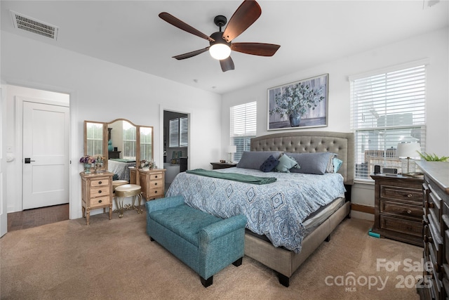 carpeted bedroom featuring ceiling fan