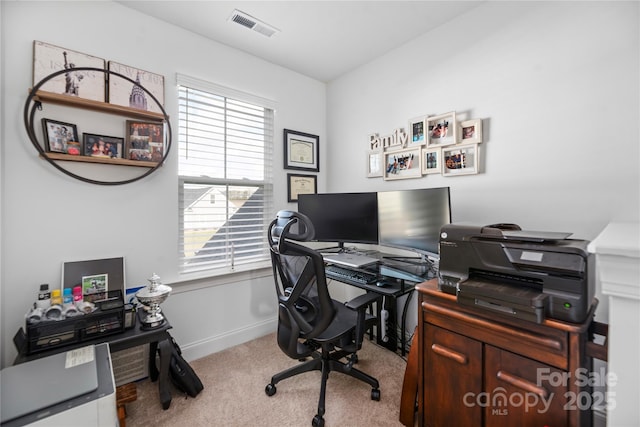 office space featuring light carpet and plenty of natural light