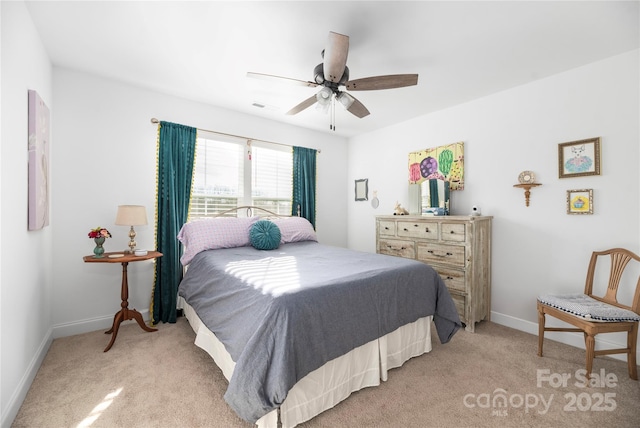 bedroom with ceiling fan and light colored carpet