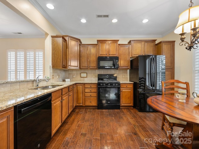 kitchen with backsplash, sink, black appliances, and ornamental molding