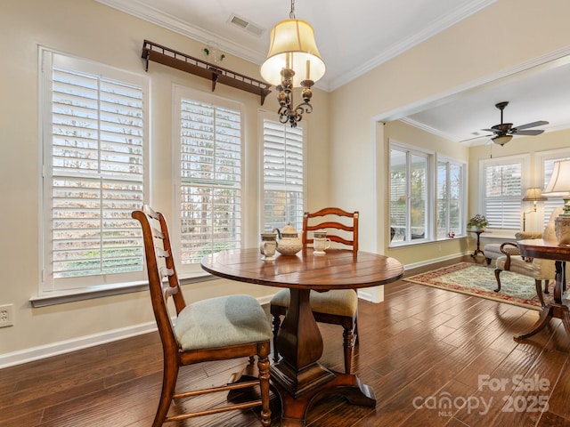 dining area with dark hardwood / wood-style flooring, ceiling fan, and ornamental molding