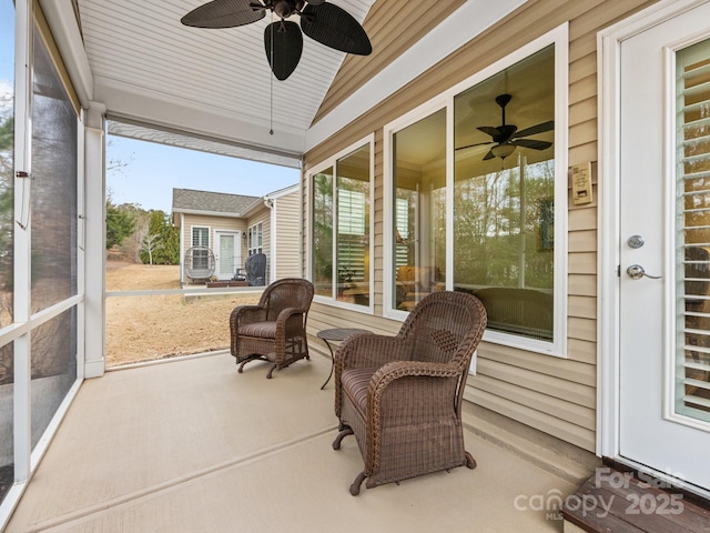 sunroom / solarium with vaulted ceiling and ceiling fan