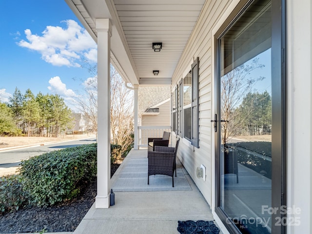 view of patio featuring a porch