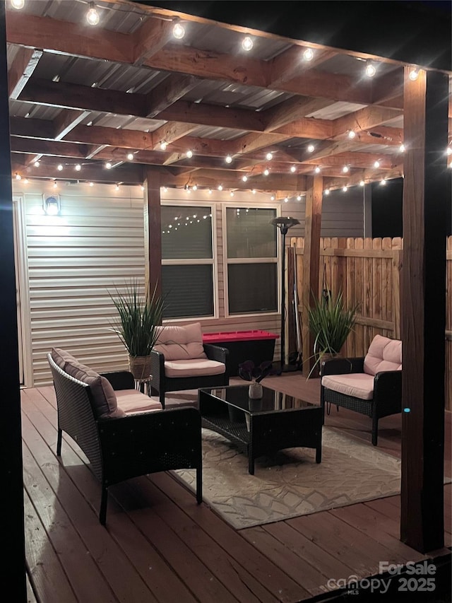 wooden deck featuring fence and an outdoor living space