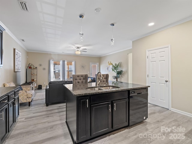 kitchen featuring visible vents, a sink, an island with sink, light wood-type flooring, and dishwasher