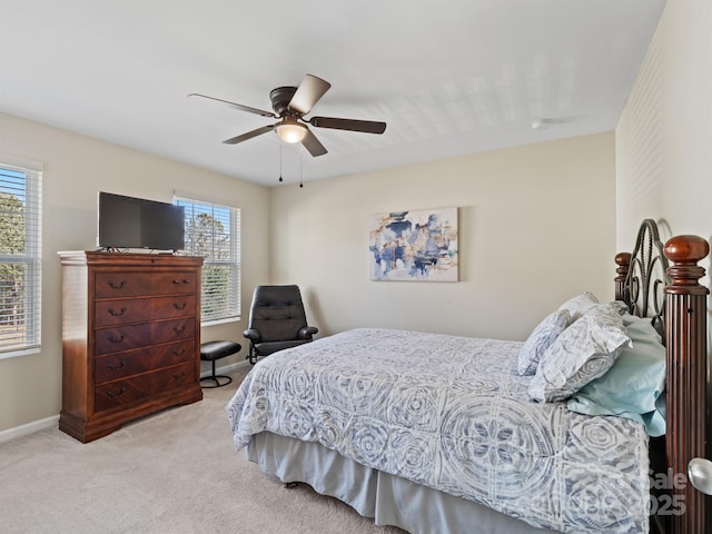 bedroom featuring carpet floors, a ceiling fan, and baseboards