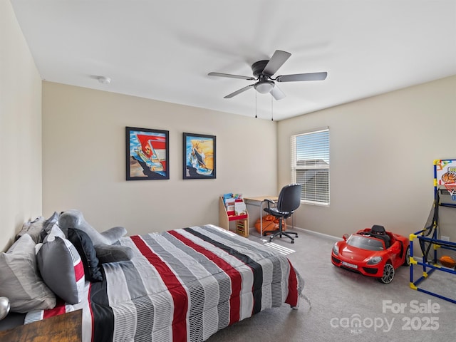 bedroom with a ceiling fan, carpet, and baseboards