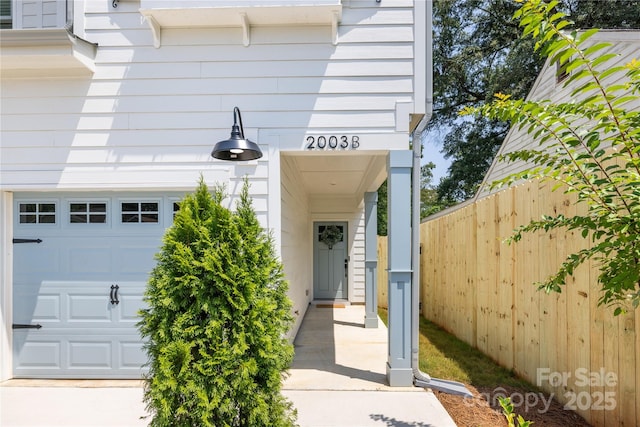 view of exterior entry featuring a garage