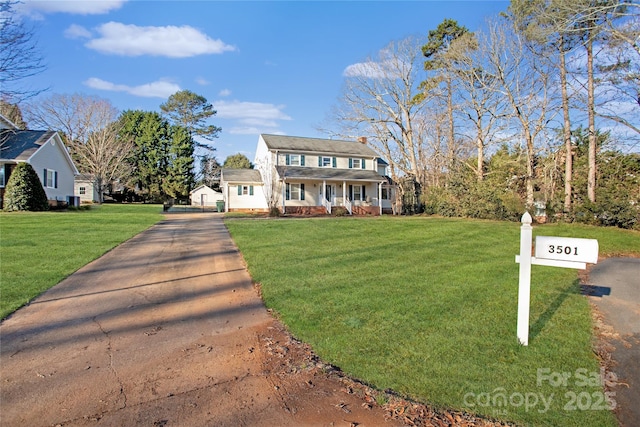 view of front of property with a porch and a front yard