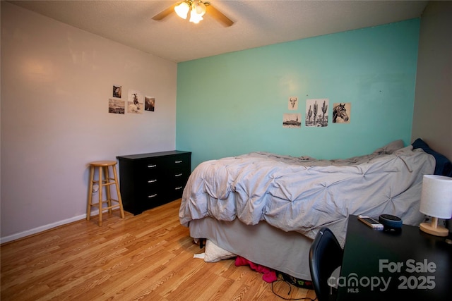 bedroom featuring ceiling fan and light wood-type flooring