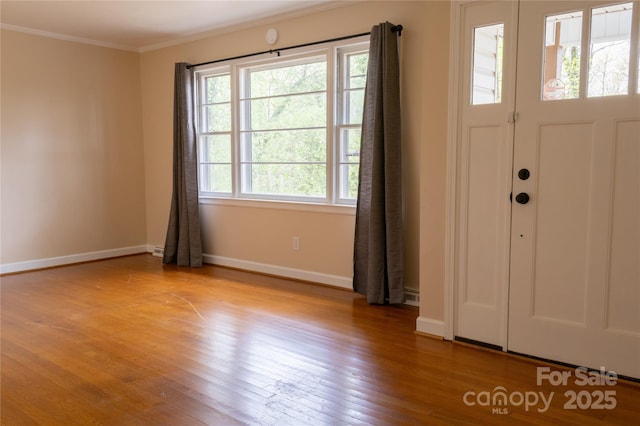 1035 Timberlane Dr, Lincolnton, NC 28092 - foyer with light wood-style flooring, ornamental molding, and baseboards
