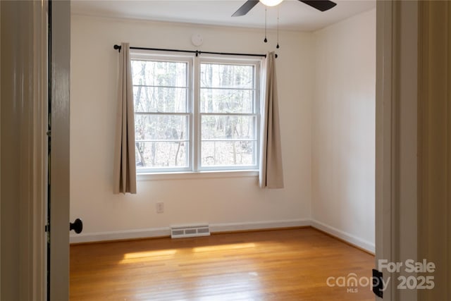 1035 Timberlane Dr, Lincolnton, NC 28092 - unfurnished room featuring baseboards, visible vents, light wood-style flooring, and a ceiling fan