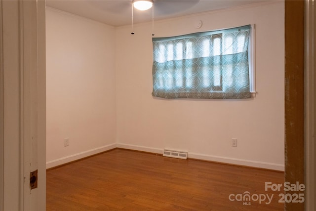 1035 Timberlane Dr, Lincolnton, NC 28092 - unfurnished room with visible vents, baseboards, ceiling fan, and wood finished floors