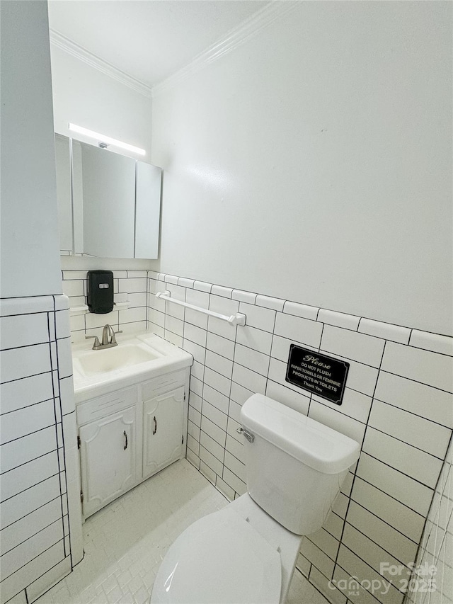 1035 Timberlane Dr, Lincolnton, NC 28092 - half bathroom with tile walls, toilet, ornamental molding, and vanity