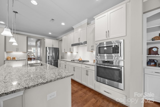 kitchen featuring white cabinetry, pendant lighting, and stainless steel appliances