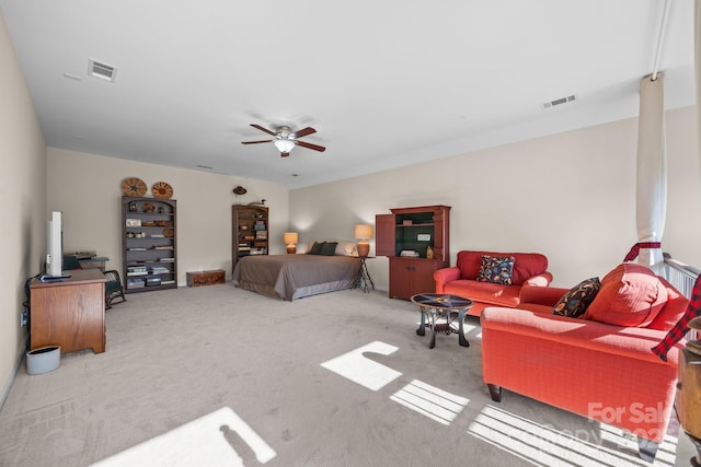 bedroom with ceiling fan and light colored carpet