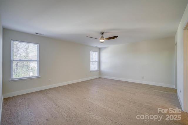 unfurnished room featuring light wood-type flooring and ceiling fan