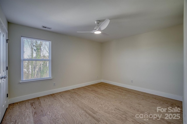 unfurnished room featuring ceiling fan and light wood-type flooring