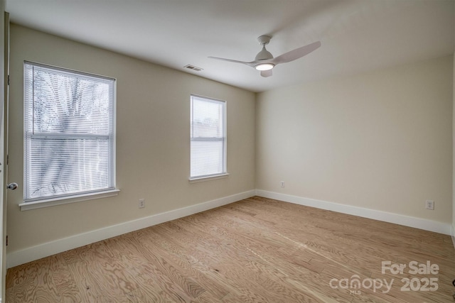 empty room featuring light hardwood / wood-style floors and ceiling fan