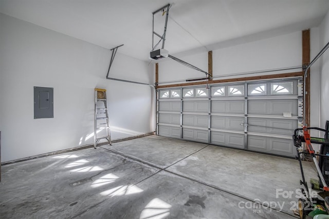 garage featuring electric panel and a garage door opener