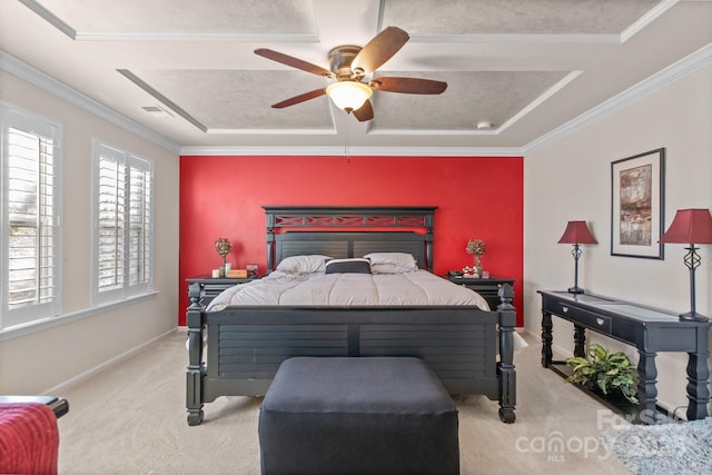 bedroom with a raised ceiling, ceiling fan, and ornamental molding