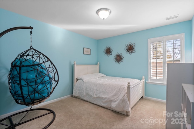 bedroom featuring light carpet