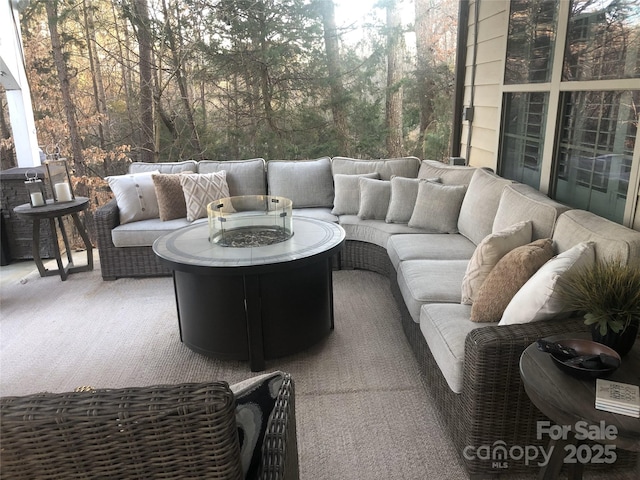 view of patio / terrace with an outdoor fire pit