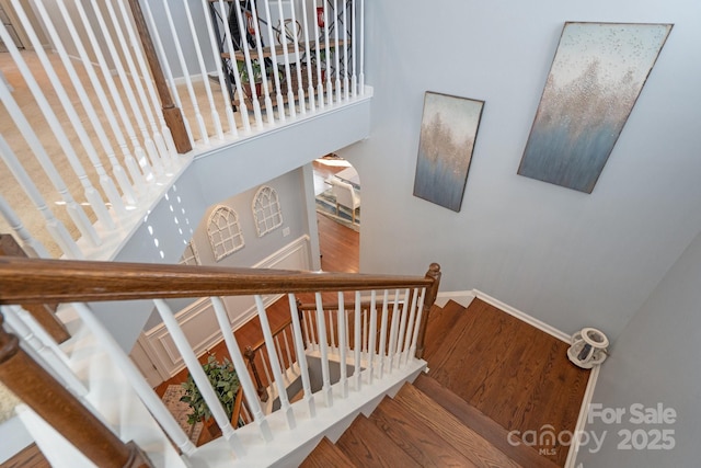 stairs with wood-type flooring