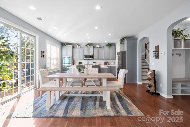 dining room with dark hardwood / wood-style flooring