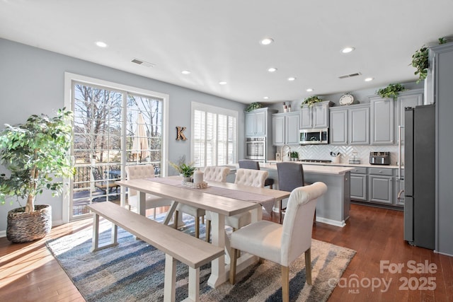 dining space featuring dark hardwood / wood-style flooring