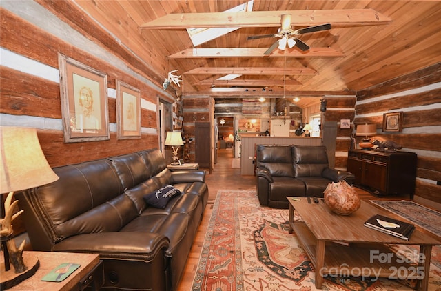 living room featuring wooden ceiling, light hardwood / wood-style flooring, vaulted ceiling with beams, ceiling fan, and rustic walls