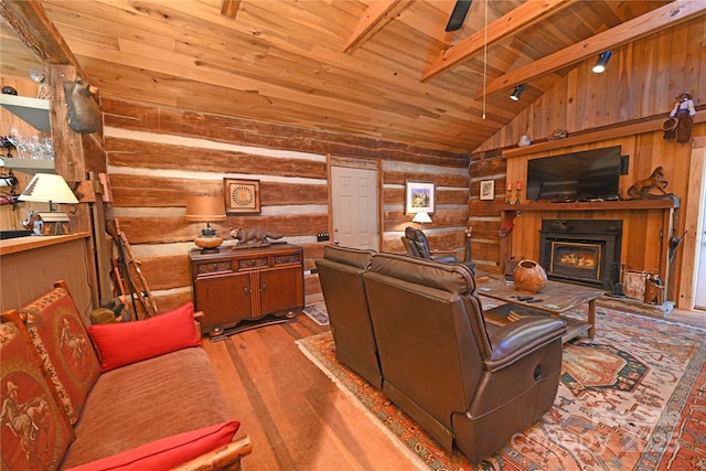 living room with rustic walls, wooden ceiling, vaulted ceiling with beams, wood walls, and light hardwood / wood-style floors