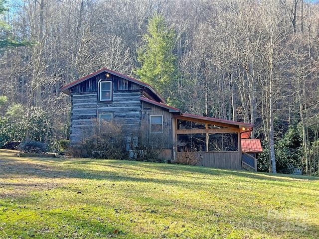 view of home's exterior featuring a yard