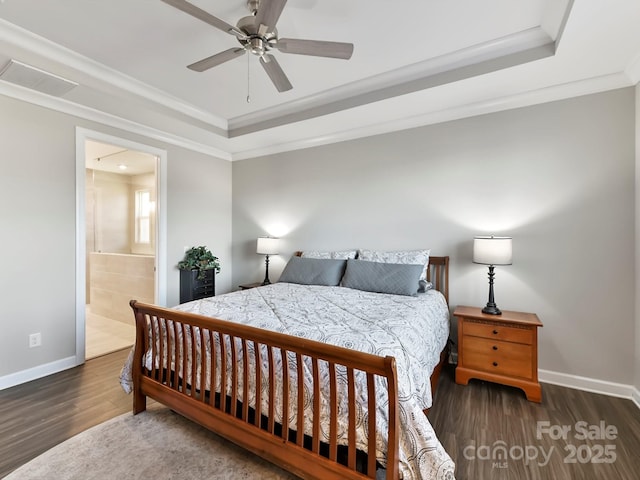 bedroom with ensuite bath, ceiling fan, crown molding, and dark hardwood / wood-style flooring