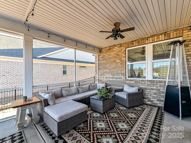 view of patio / terrace featuring ceiling fan and an outdoor living space