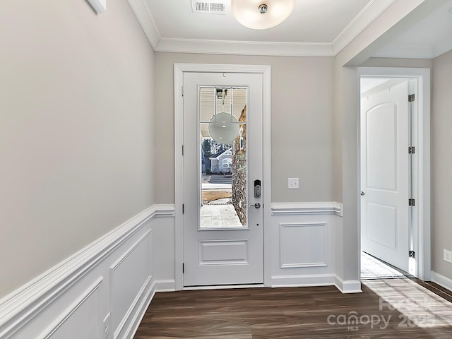 doorway featuring ornamental molding and dark hardwood / wood-style floors